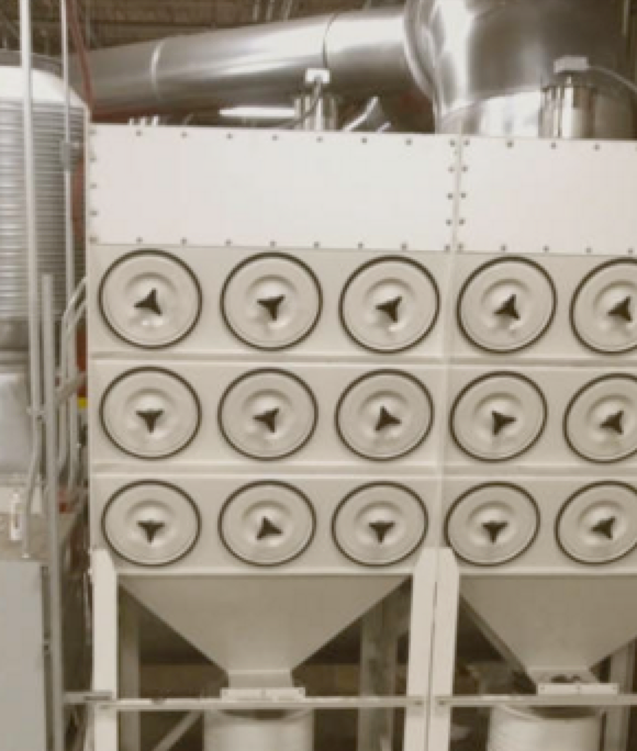 Dynamo dust collector system installed in an industrial facility.